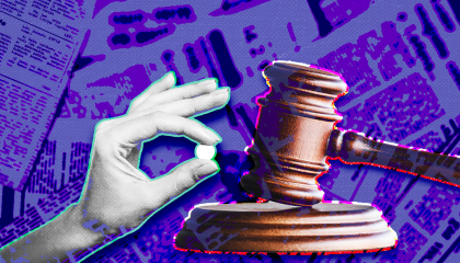 A hand holding a pill is to the left of a court gavel. The background is purple-toned scattered newspapers. 
